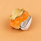 Orange frog case in a straw hat, head tipped back off the white lower shell