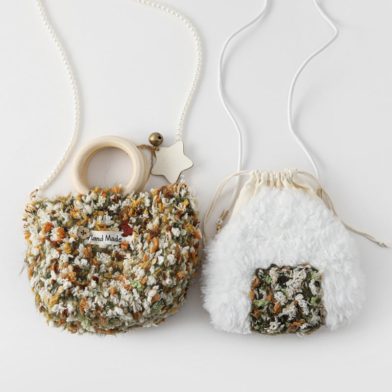 Large multicolor knit bag beside small white plush bag showing both size options
