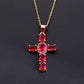 Cross pendant set with blue cubic zirconia stones on a slim plated chain
