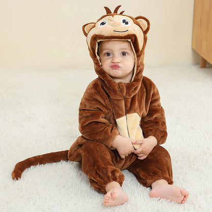 Brown monkey hooded flannel baby jumpsuit with animal face hood and tail, baby sitting on a white rug