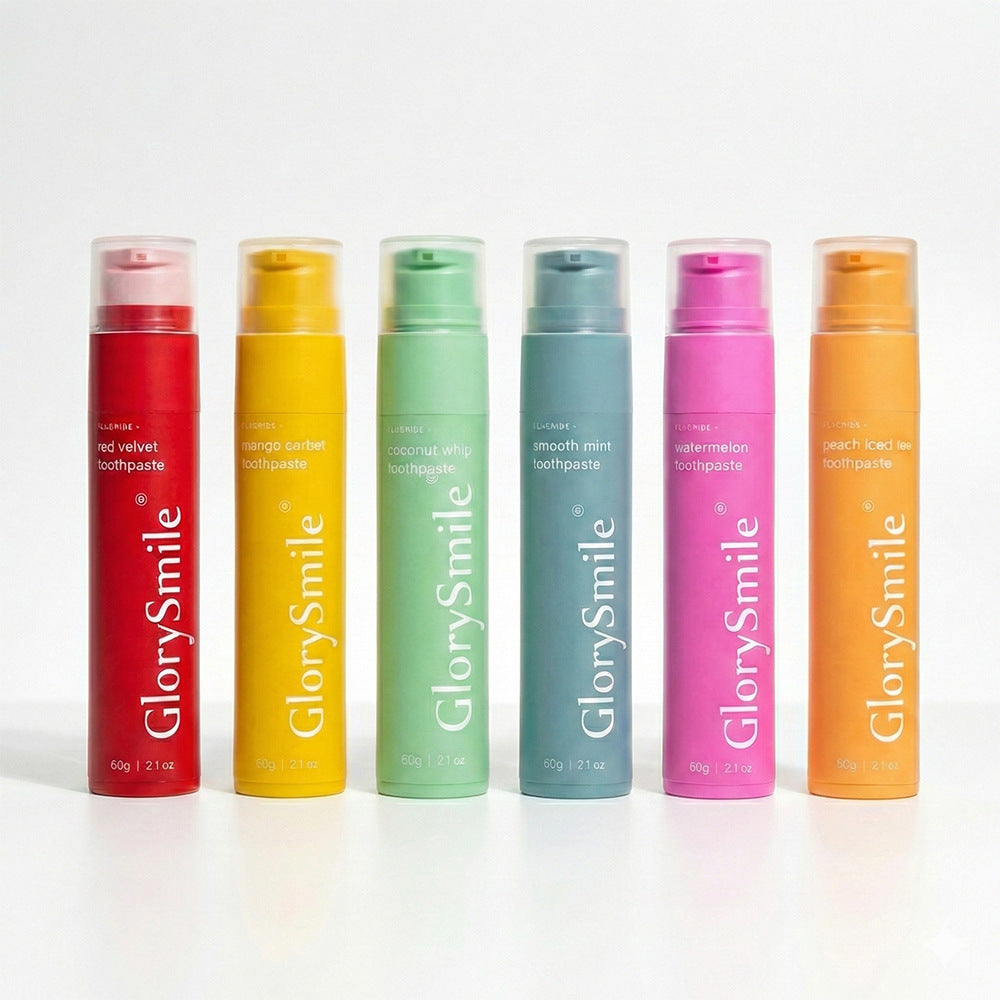 GlorySmile fruity toothpaste tubes shown standing in matching flavor colors