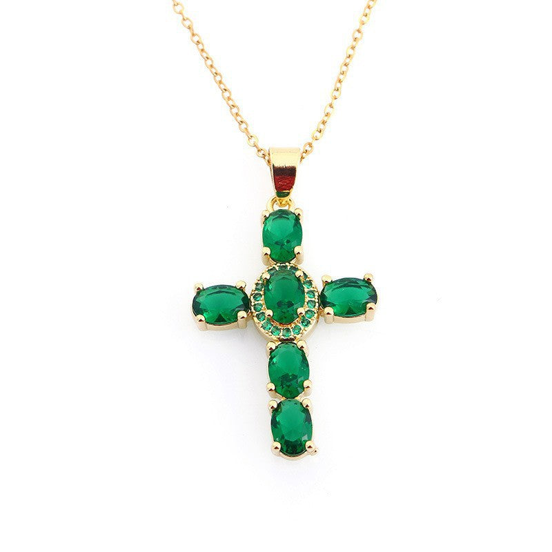 Marquise cut colored cubic zirconia cross pendant on a fine chain, angled view