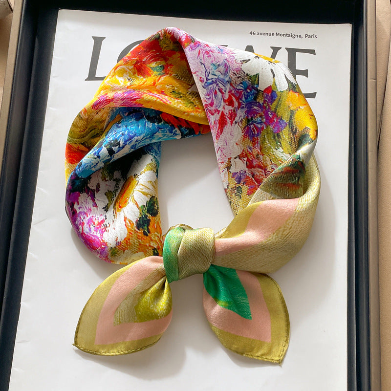 Pink and blue floral printed square scarf with a satin sheen and hemmed edges, shown displayed