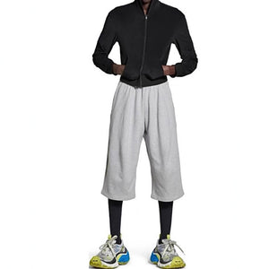 Gray loose-fitting sweatpants front view with elastic drawstring waist