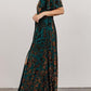 Full length view of the green floral burnout velvet wrap maxi dress with short flutter sleeves