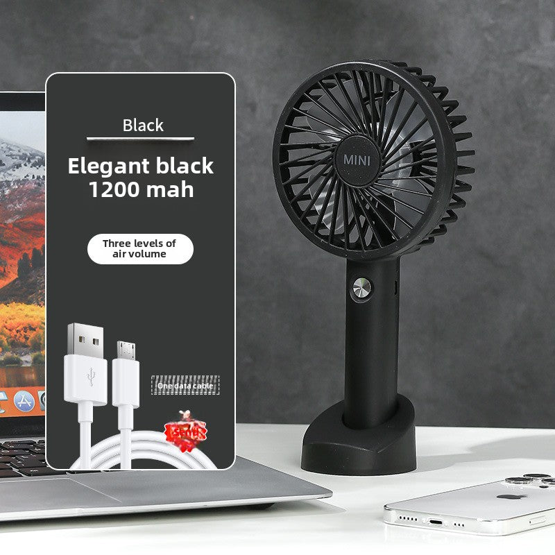Angled hero shot of the mini USB rechargeable handheld fan in color