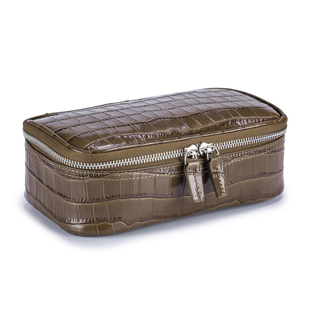 Brown crocodile pattern genuine leather cosmetic bag with silver double zipper, three quarter view