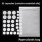 Sheet of thirty five hydrocolloid discs on black beside the plain paper and plastic sachet