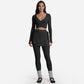 Close view of the front cross tie waist detail on the wrap top