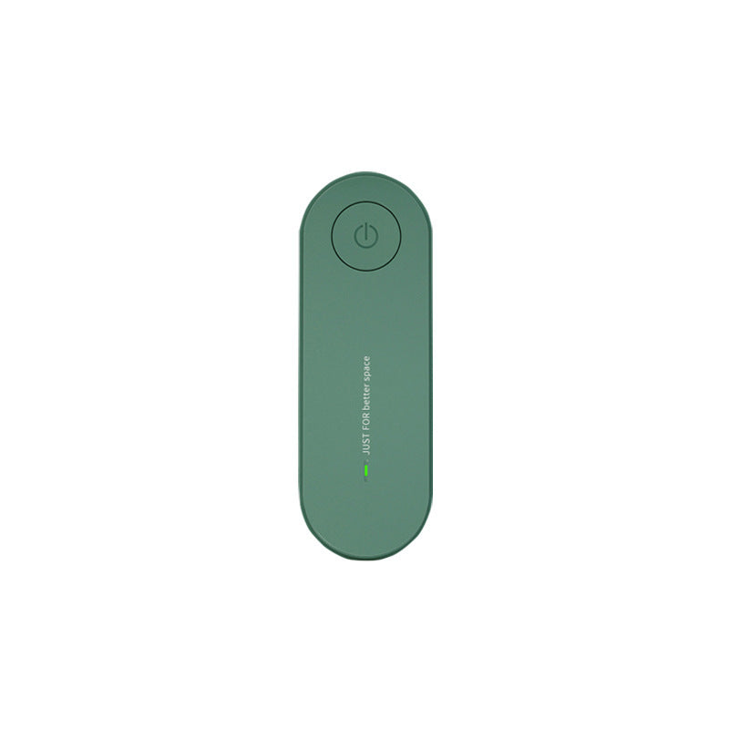 Green flat oval ion generator unit, single power button at the top and a status line below