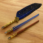Three European style dip pens with stainless steel nibs and ornate gold tone grips and gold flecked barrels