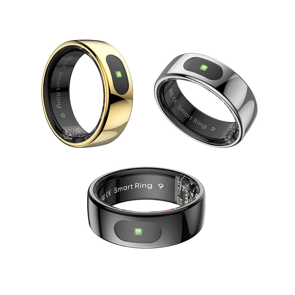 Gold smart ring with a polished steel shell photographed at an angle