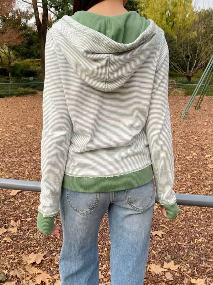 Back view of the green striped zip-up hoodie showing the hood, green hood lining and ribbed hem