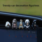 Bird, hippo, meerkat, panda and black bear resin figurines fishing from a screen ledge