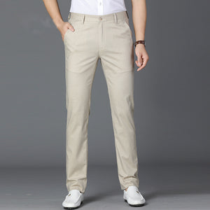 Beige linen blend mens straight leg trousers front view worn over white loafers