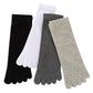 Four five-toe cotton socks laid flat in black, white, dark gray and light gray