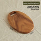 Oval walnut wood board 36 by 26 cm shown as a serving platter