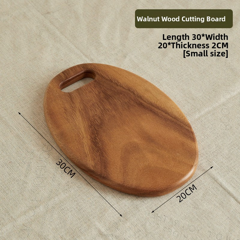 Oval walnut wood board 36 by 26 cm shown as a serving platter