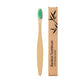 Bamboo toothbrush handle detail showing the smooth flat grip