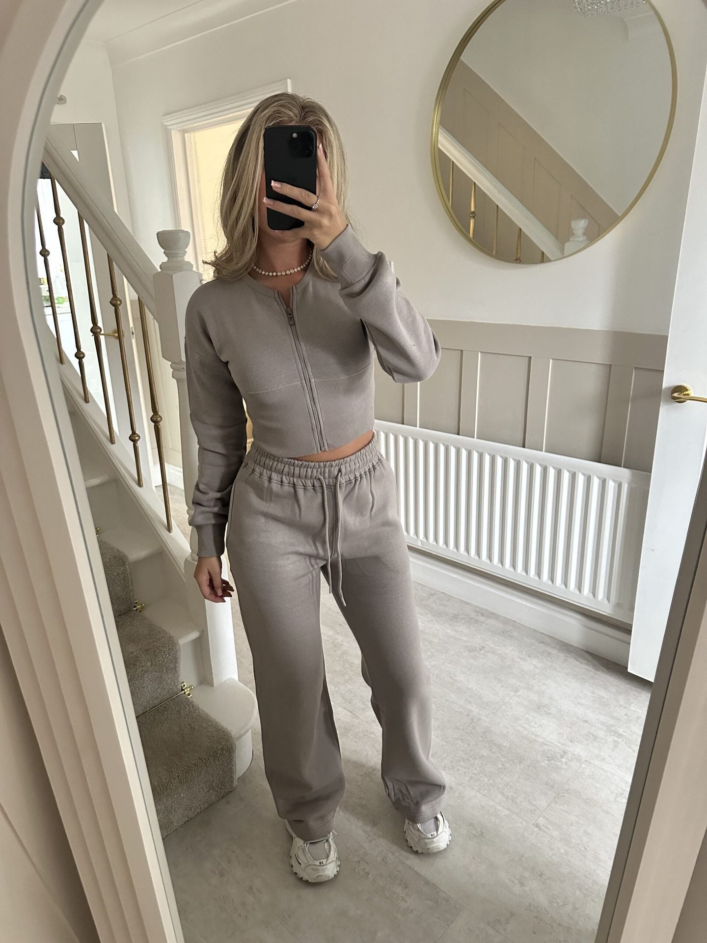 Womens two piece lounge set, a front zip jacket and straight leg drawstring pants in a soft sweat knit