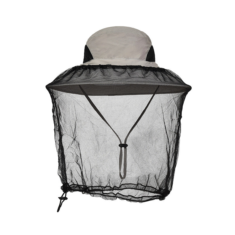 Mosquito net sun hat worn outdoors with the net down over the face