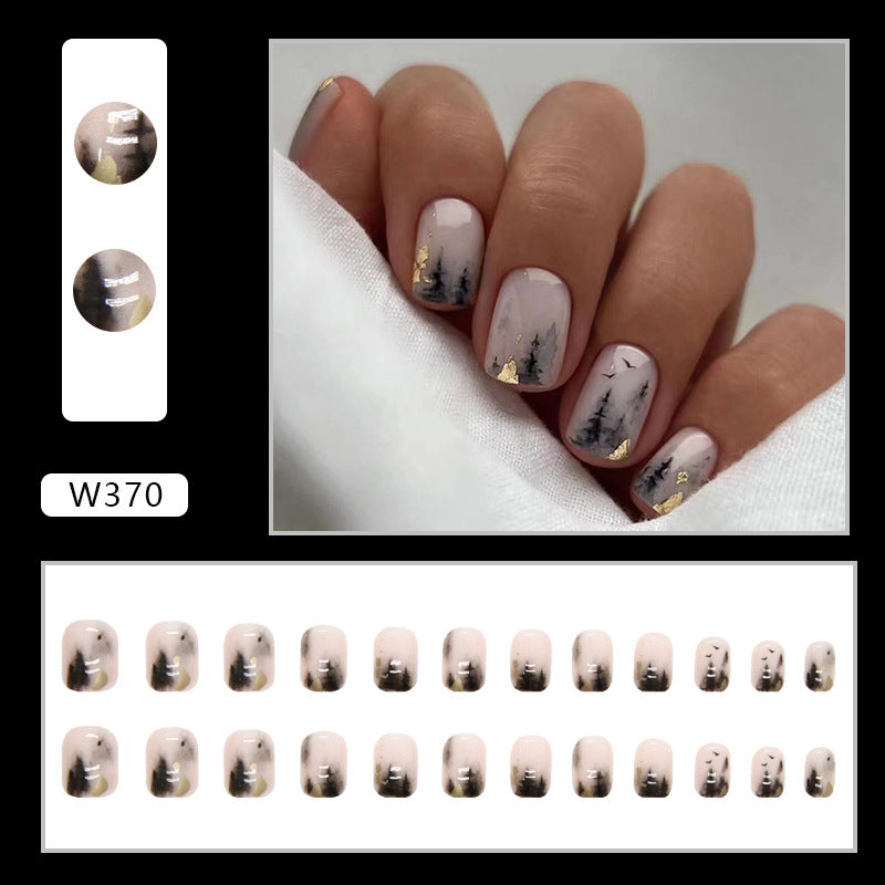 Full cover press-on almond nails in an ink shadow design, glossy finish shown on a hand