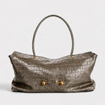 Taupe croc embossed shoulder bag with two gold ball studs and one round top handle on white