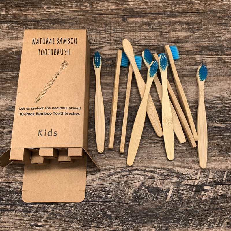 Soft-bristled bamboo toothbrush set | scale reference next to a hand