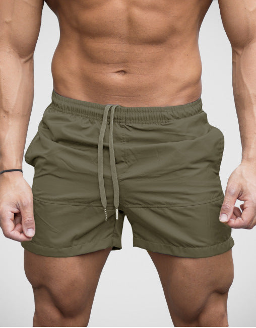 Grey lightweight beach shorts showing short leg and split side hem