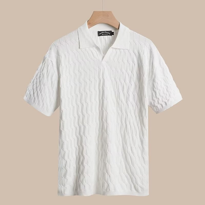 White knit polo worn with light trousers to show the slim casual cut