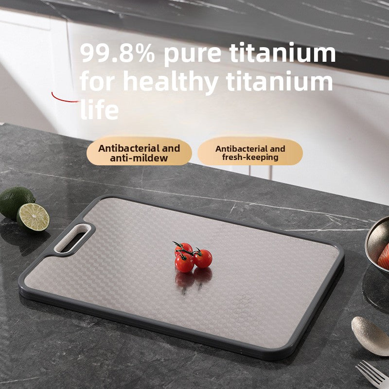 Titanium-faced cutting board in use during kitchen prep with a knife