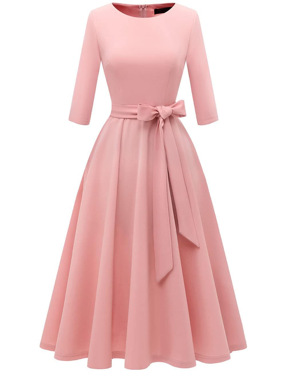Detail of the pleated A-line skirt falling full on the vintage swing cocktail dress
