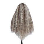 Back view of a long textured wave synthetic wig in brown with platinum blonde streaks on a white background