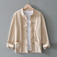 Khaki frog closure shirt jacket with stand collar on a hanger over a white tee, image of the size 4XL option