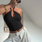 Detail of the gold O-ring hardware and stitching at the halter top neckline