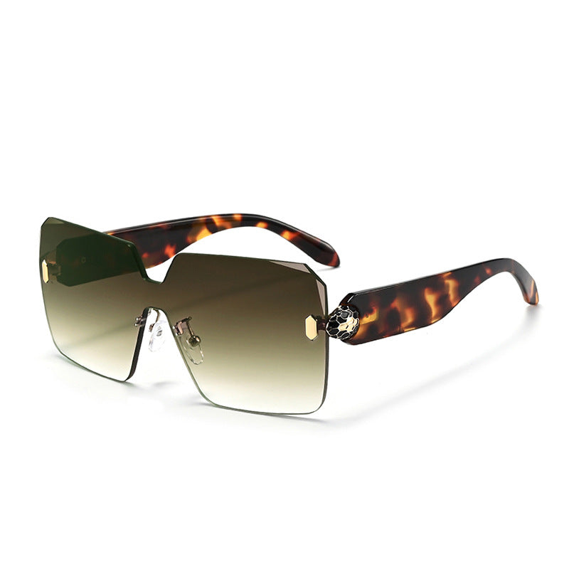 Rimless shield sunglasses with the bevelled lens edge catching light along the outline