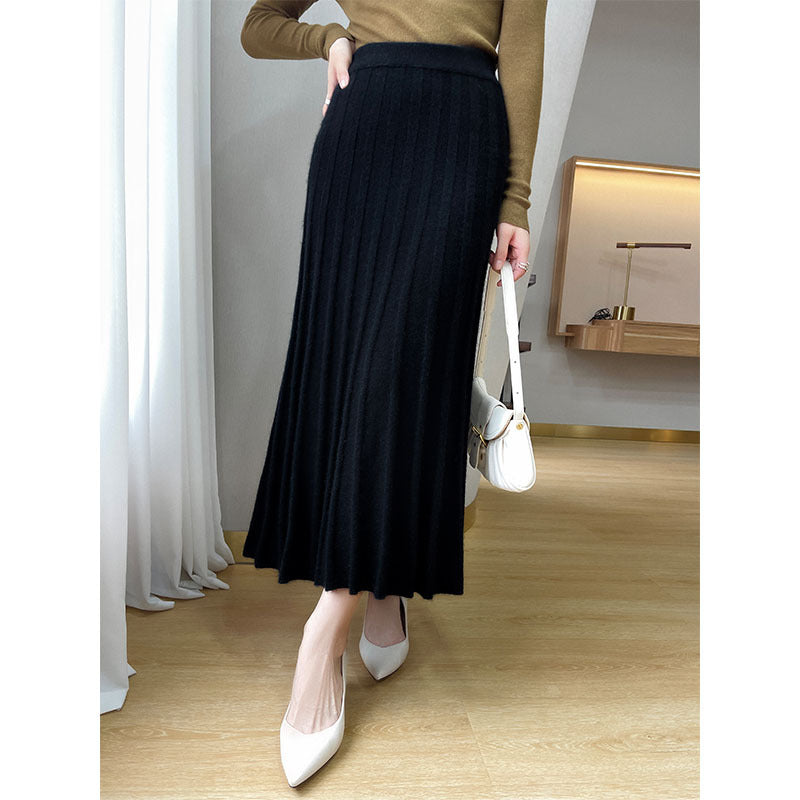 Ribbed wool midi skirt shown with knitwear layered on top