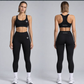 Woman in black sports bra and black high waist leggings, front and back, L variant photo