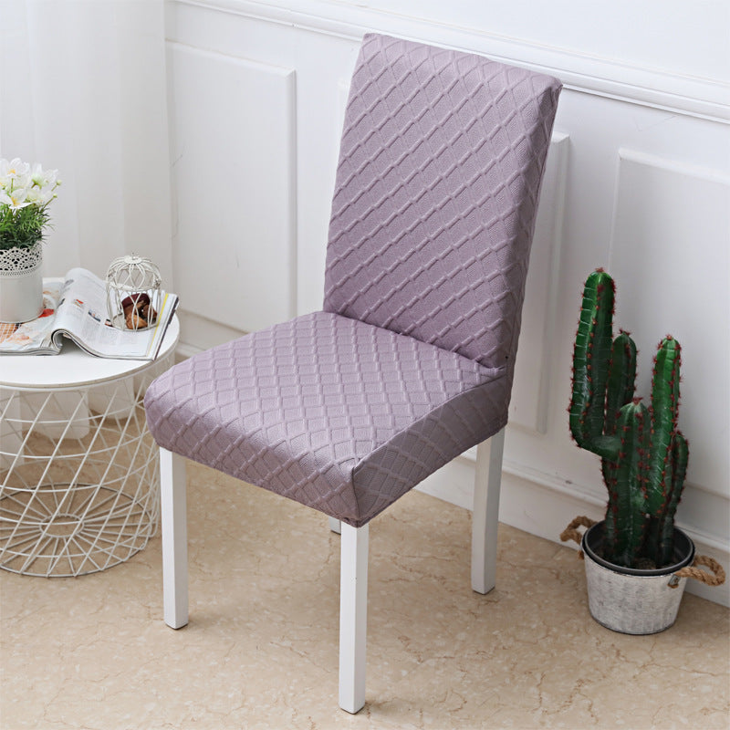 Underside of a stretch chair cover showing the elastic hem under the seat