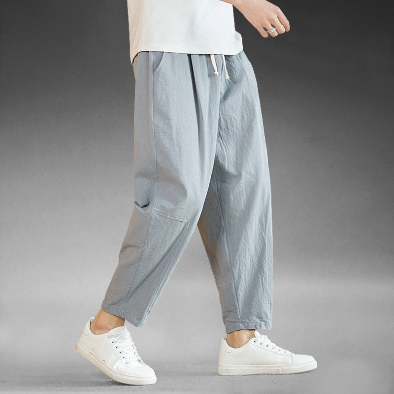 Mens wide leg cotton linen casual pants, relaxed straight cut to an ankle length hem, on model