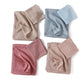 Four hijab sets folded in beige, blue, rose and nude, each with a matching tube undercap