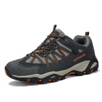 Unisex outdoor hiking shoe with a mesh and suede upper and a lugged rubber outsole
