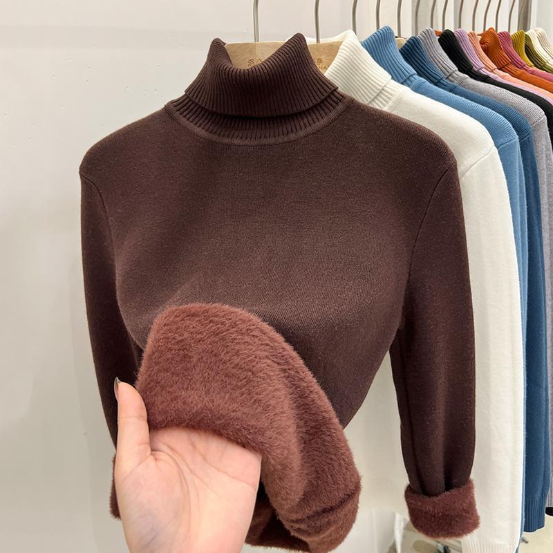 Coffee brown high collar sweater with a hand showing the chocolate brown plush lining
