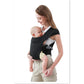 Black cotton X-type front baby carrier with a baby facing the wearer and cross-back straps