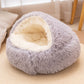 Long plush pet nest with a cream interior and a thick cushioned base