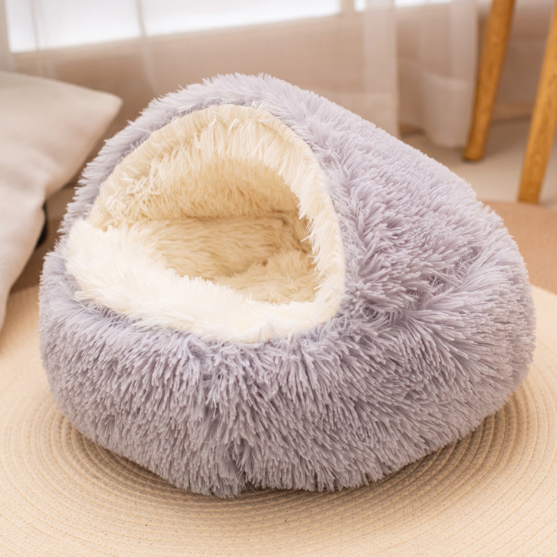 Long plush pet nest with a cream interior and a thick cushioned base