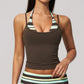 Model in a cropped camisole with a printed halter inset, brown with mint and cream stripes