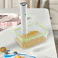 Vacuum sealer drawing air from a valve container of dried beans