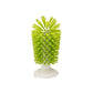 Green bristled glass cleaning brush standing upright on a white suction base