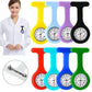 Silicone nurse fob watches shown with the pin back and worn on a white coat